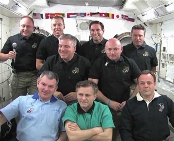 The crew of space shuttle Endeavour and the International Space Station gather for a joint news conference from the from the space station Thursday, May 26, 2011.